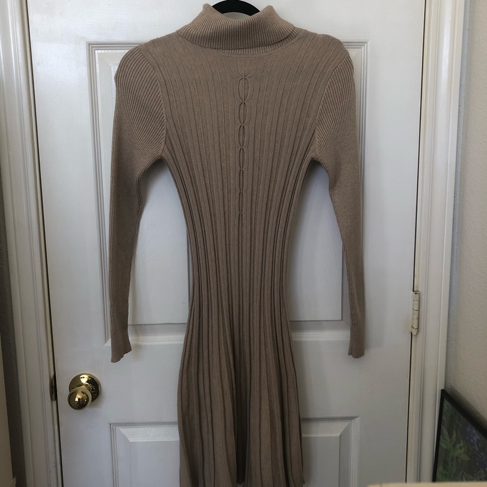 Tan form fitting turtleneck dress
